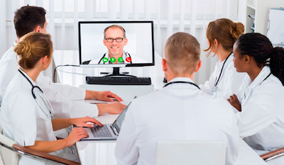 Group of Clinicians Meet with Client Using Telehealth