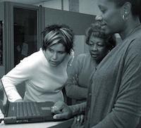Three People at Computer