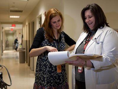 two clinicians reviewing a chart