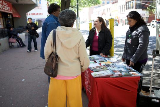 people at an information table